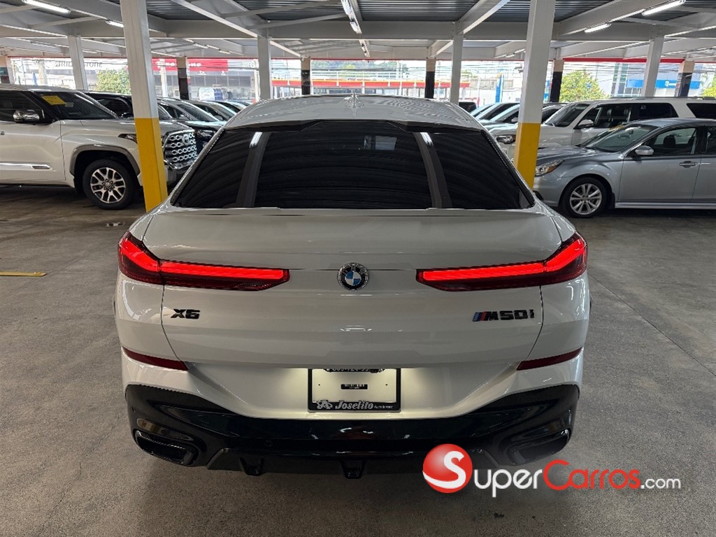 2020 BMW X 6 M50i — foto 6 / 12